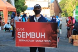 Warga yang sembuh bersiap pulang dari tempat isolasi dan perawatan (foto Humas Pemkot Surabaya).