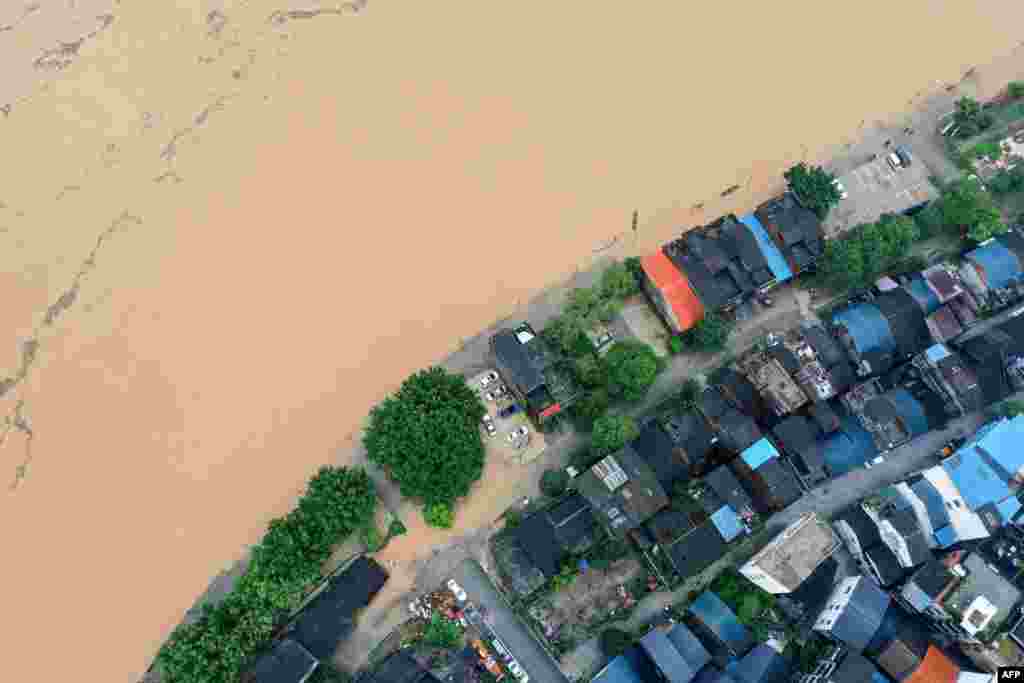This image from above shows a flooded street along the Rongjiang river after heavy rains in Rongan, in China&#39;s southern Guangxi area.