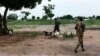 FILE - A soldier from Sudan People's Liberation Army-In Opposition (SPLA-IO) walks goats in Leer, Unity State.