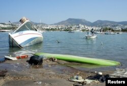 Damaged boats are seen after an earthquake and a tsunami in the resort town of Gumbet in Mugla province, Turkey, July 21, 2017.