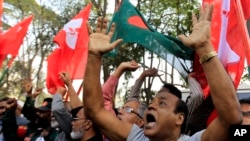 Bangladeshi activists shout slogans as they celebrate outside the International Crimes Tribunal where leaders of the country’s largest Islamic party the Jamaat-e-Islami party are on trial in Dhaka, Bangladesh, Feb. 5, 2013.