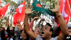 Bangladeshi activists shout slogans as they celebrate outside the International Crimes Tribunal where leaders of the country’s largest Islamic party the Jamaat-e-Islami party are on trial in Dhaka, Bangladesh, Feb. 5, 2013.