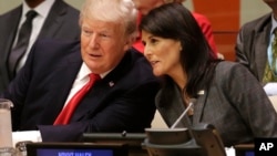 President Donald Trump speaks with U.S. Ambassador to the United Nations Nikki Haley before a meeting during at the United Nations, Sept. 18, 2017. 