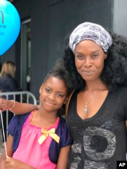 Clarissa Williams of West Hempstead, N.Y., and her daughter Nylah, 8, saw one of the final shows of Ringling Brothers and Barnum & Bailey circus at the Nassau Veteran's Memorial Coliseum in Uniondale, N.Y., May 20, 2017. Williams is a lifelong circus fan