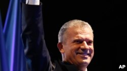 FILE - Fahrudin Radoncic leader of the SBB party (Union for a Better Future of BiH) addresses supporters during a rally in Sarajevo, Oct. 10, 2014. 