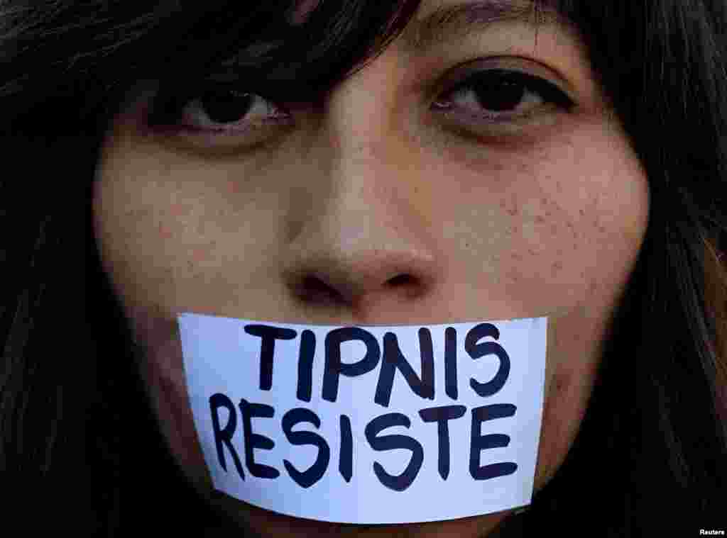 An activist protests against government proposal plans to annul laws protecting the Isiboro Secure Park in La Paz, Bolivia, Aug. 8, 2017.