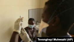 Virus Outbreak Zimbabwe Vaccines Mandate