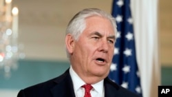 FILE - U.S. Secretary of State Rex Tillerson answers a reporter's question at the State Department, in Washington, Oct. 13, 2017.