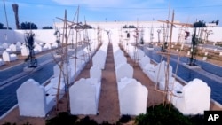 FILE: The cemetery for migrants who have died trying to reach Europe, in the village of Zarzis, Tunisia. , Saturday June 12, 2021. Rachid Koraïchi bought the plot of land to be used as a final resting place for people who died trying to migrate. 