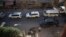 Vehicles of a UN and SARC aid convoy, with food, nutrition, health and other emergency items, enter the rebel-held town of Douma, east of the Syrian capital Damascus, June 10, 2016.
