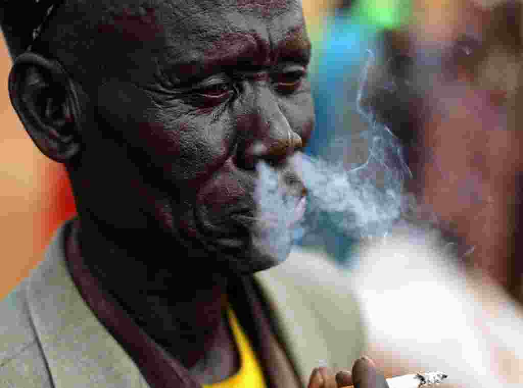 Dec. 28: A boy uses a paper horn to get the attention of a tiger at the Malabon zoo, north of Manila. The year 2010 is the year of the Golden Tiger, which ends on February 2, 2011 in the Chinese zodiac calendar. (Romeo Ranoco/Reuters)