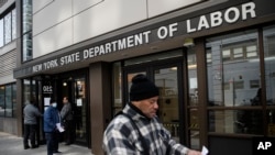 Visitors to the Department of Labor are turned away at the door by personnel due to closures over coronavirus concerns in New York, March 18, 2020.