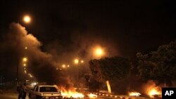 A fire barricade set by fugitives at the entrance of el-Sheikh Zoyed, North Sinai, Aug. 22, 2011.