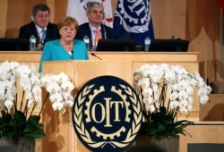 FILE - German Chancellor Angela Merkel speaks during the International Labor Organization's annual labor conference in Geneva, June 11, 2019.