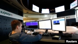 FILE - An employee works at the headquarters of Kaspersky Labs, a computer security company in Moscow.