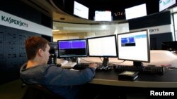 FILE - An employee works at the headquarters of Kaspersky Labs, a computer security company in Moscow.