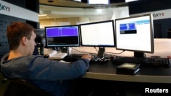 FILE - An employee works at the headquarters of Kaspersky Labs, a computer security company in Moscow.