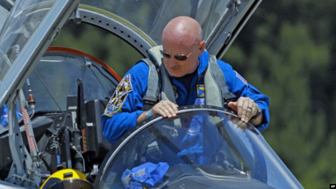 Mission Commander Mark Kelly climbs from his T-38 jet trainer as he arrives with the crew of space shuttle Endeavour's mission STS-134 at the Kennedy Space Center in Cape Canaveral, Florida, April 26, 2011