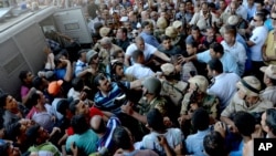 Egyptian Army soldiers respond to clashes between supporters and opponents of ousted President Mohammed Morsi in Alexandria, Egypt, Sept. 13, 2013.