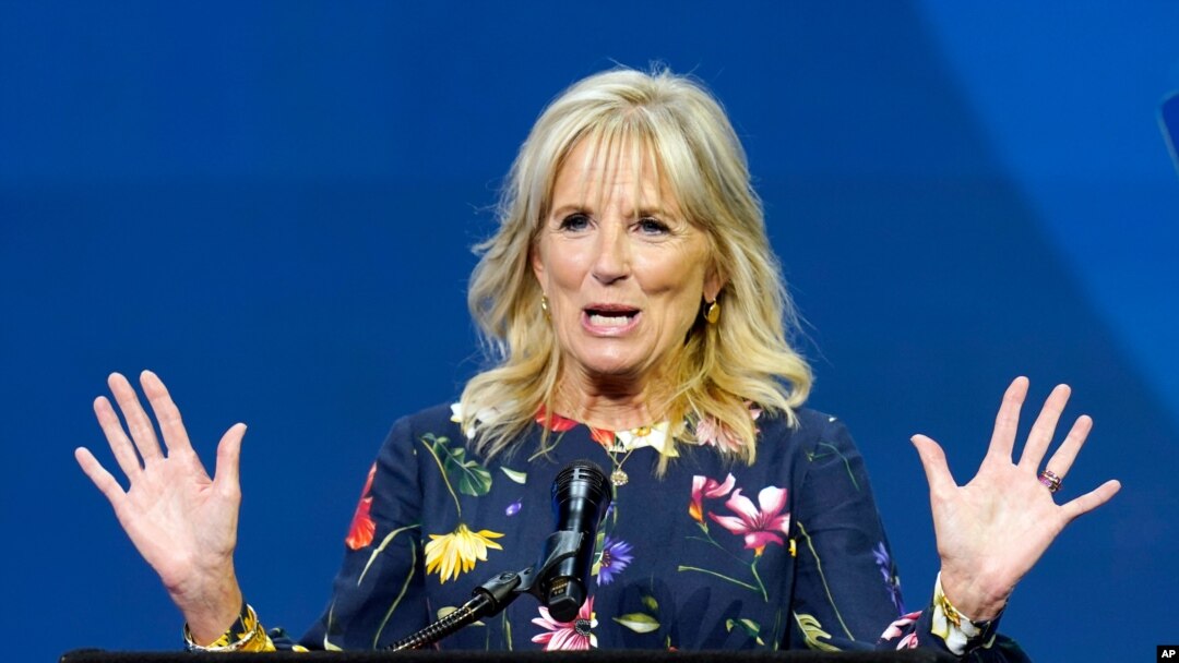 In this July 8, 2021 photo, first lady Jill Biden delivers remarks before the start of the finals of the 2021 Scripps National Spelling Bee at Disney World in Lake Buena Vista, Fla. Jill Biden will attend the opening ceremony of the summer Olympic…