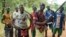 FILE - Fighters from a Christian militia movement known as the "anti-balaka" display their makeshift weaponry in the village of Boubou, halfway between the towns of Bossangoa and Bouca, in the Central African Republic.