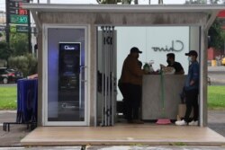 Government employees open the customer service area of a Chivo digital wallet machine, which exchanges cash for Bitcoin cryptocurrency, at Las Americas Square in San Salvador, El Salvador, September 7, 2021.