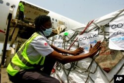 FILE - A shipment of COVID-19 vaccines distributed by the COVAX global initiative arrives in Abidjan, Ivory Coast, Feb. 25, 2021.