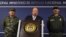 Colombia's Defense Minister Luis Carlos Villegas (C) delivers a speech, next to Colombian armed forces chief General Juan Pablo Rodriguez (L) and director of national police General Rodolfo Palomino (R) during a news conference in Bogota, Colombia October