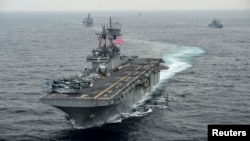 FILE - The amphibious assault ship USS Boxer transits the East Sea during an exercise, March 8, 2016. 