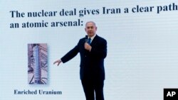 FILE - Israeli Prime Minister Benjamin Netanyahu presents material on Iranian nuclear weapons development during a press conference in Tel Aviv, April 30, 2018. Netanyahu said his government had obtained "half a ton" of secret Iranian documents proving the Tehran government once had a nuclear weapons program.