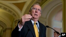 Senate Minority Leader Mitch McConnell of Ky. gestures during a news conference on Capitol Hill in Washington, May 21, 2013.