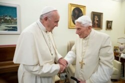 FILE - Pope Francis (L) visits his predecessor, Pope Emeritus Benedict XVI, at the Mater Ecclesiae Monastery in the Vatican, Dec. 21, 2018.