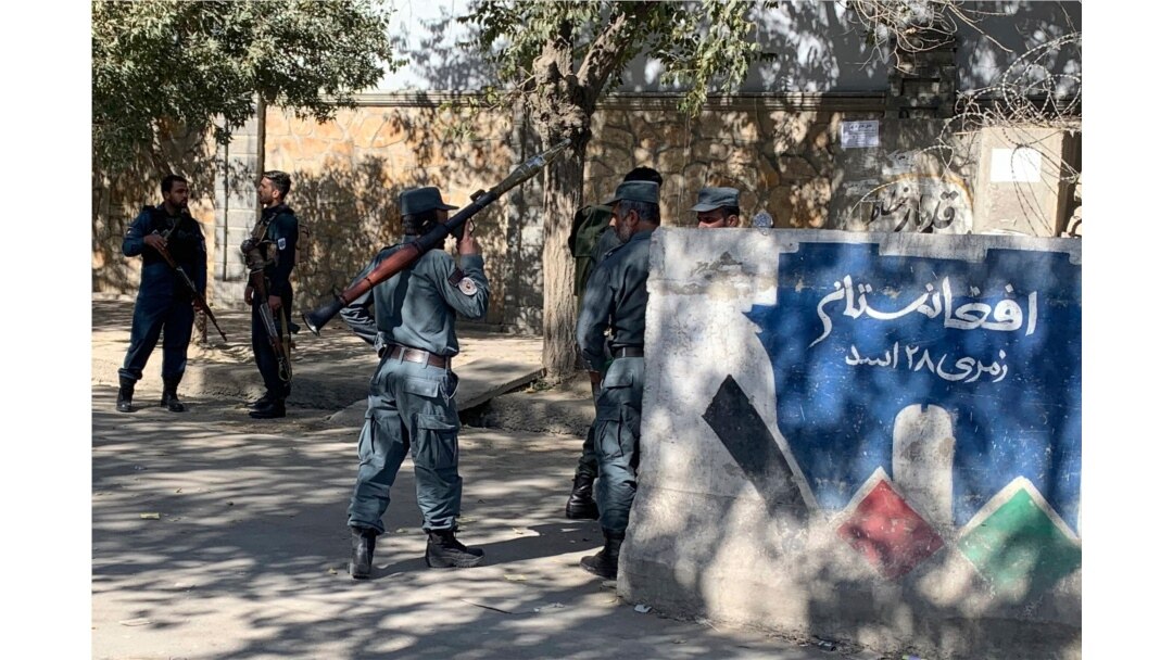 Afghan police arrive at the site of an attack at Kabul University in Kabul, Afghanistan, Nov. 2, 2020. Gunfire erupted at the university in the Afghan capital early Monday and police have surrounded the sprawling campus, authorities said.