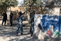 Afghan police arrive at the site of an attack at Kabul University in Kabul, Afghanistan, Nov. 2, 2020. Gunfire erupted at the university in the Afghan capital early Monday and police have surrounded the sprawling campus, authorities said.