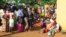Family members and onlookers mourn over the bodies of civilians killed by The Allied Democratic Forces rebels in Beni, Eastern Congo, Oct 5, 2018.