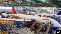 FILE - Workers assemble Boeing 787 Dreamliners at the company's massive assembly plant in North Charleston, S.C. 