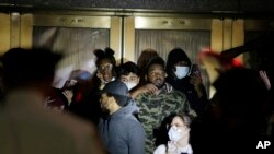 Police officers surround a group of people at Radio City Music Hall before arresting them in New York, June 1, 2020.