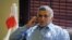 FILE - Bahrain human rights activist Nabeel Rajab is seen talking on his mobile phone.