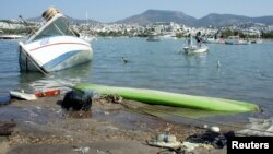 Damaged boats are seen after an earthquake and a tsunami in the resort town of Gumbet in Mugla province, Turkey, July 21, 2017. 