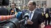 French President Francois Hollande gestures as he speaks to reporters upon his arrival for an EU summit, at the European Council building in Brussels, May 23, 2012.