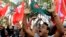 Bangladeshi activists shout slogans as they celebrate outside the International Crimes Tribunal where leaders of the country’s largest Islamic party the Jamaat-e-Islami party are on trial in Dhaka, Bangladesh, Feb. 5, 2013.