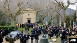 FILE - A ceremony to remember the victims of the Nazi massacre during the World War II is held at the church of Sant' Anna di Stazzema in Sant'Anna di Stazzema, March 24, 2013.