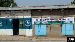 FILE - A general view of a banner of the National Rally for Democracy in Chad calling on citizens to stay at home during the referendum vote, in N'Djamena on December 13, 2023.