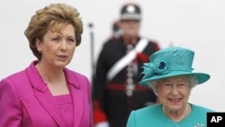 Ireland's President Mary McAleese welcomes Britain's Queen Elizabeth at her residence in Dublin, May 17, 2011