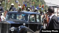 President Robert Mugabe being driven in the traditional limmousine at the official opening ceremony