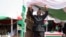 FILE - Burundi's President Evariste Ndayishimiye gestures to the crowd after his inauguration in Gitega, Burundi, June 18, 2020. 