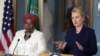 Secretary of State Hillary Rodham Clinton speaks to the media as African Union Chairperson Nkosazana Dlamini-Zuma, left, listens after their meeting in Washington, November 28, 2012. 