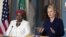 Secretary of State Hillary Rodham Clinton speaks to the media as African Union Chairperson Nkosazana Dlamini-Zuma, left, listens after their meeting in Washington, November 28, 2012. 