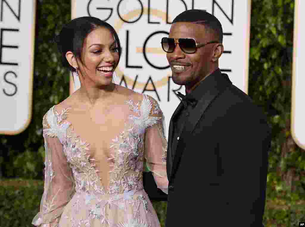 Corinne Bishop, left, and Jaime Foxx arrive at the 73rd annual Golden Globe Awards on Jan. 10, 2016, at the Beverly Hilton Hotel in Beverly Hills, Calif.