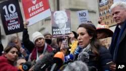 Julian Assange's fiancee, Stella Moris, speaks outside the High Court, in London, Britain, Jan. 24, 2022. 